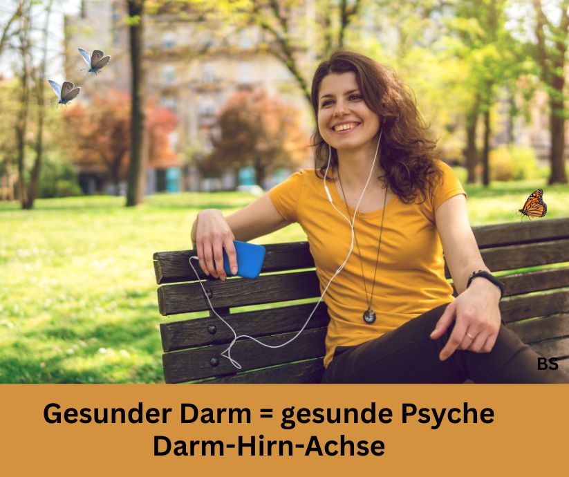 Gesunder Darm - Vital Supplements Eine lachende Frau im Park die Musik hört. Schriftzug: Gesunder Darm = gesunde Psyche, Darm-Hirn-Achse.